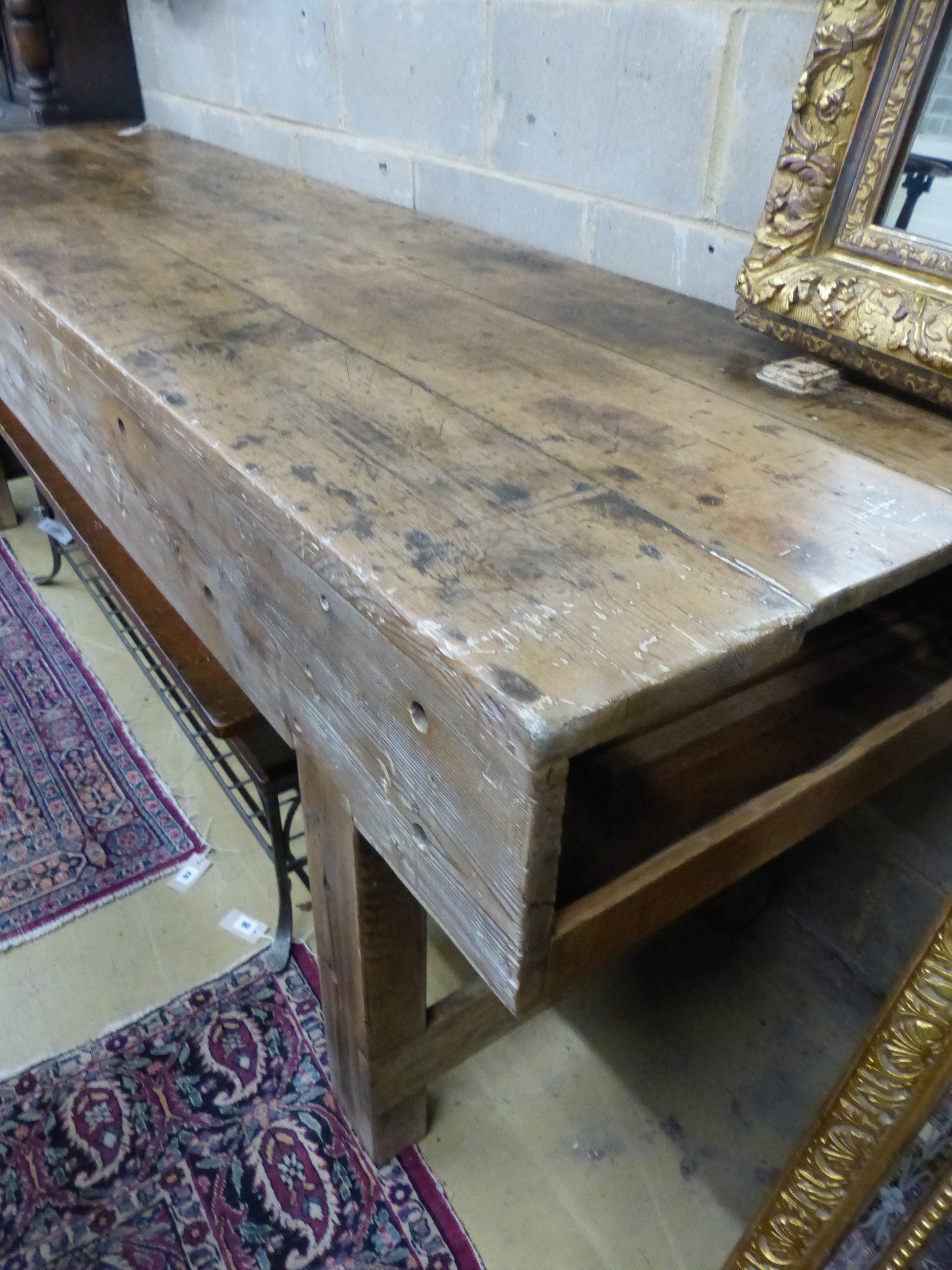 A 19th century pine workbench with original vice, W.244cm D.70cm H.83cm